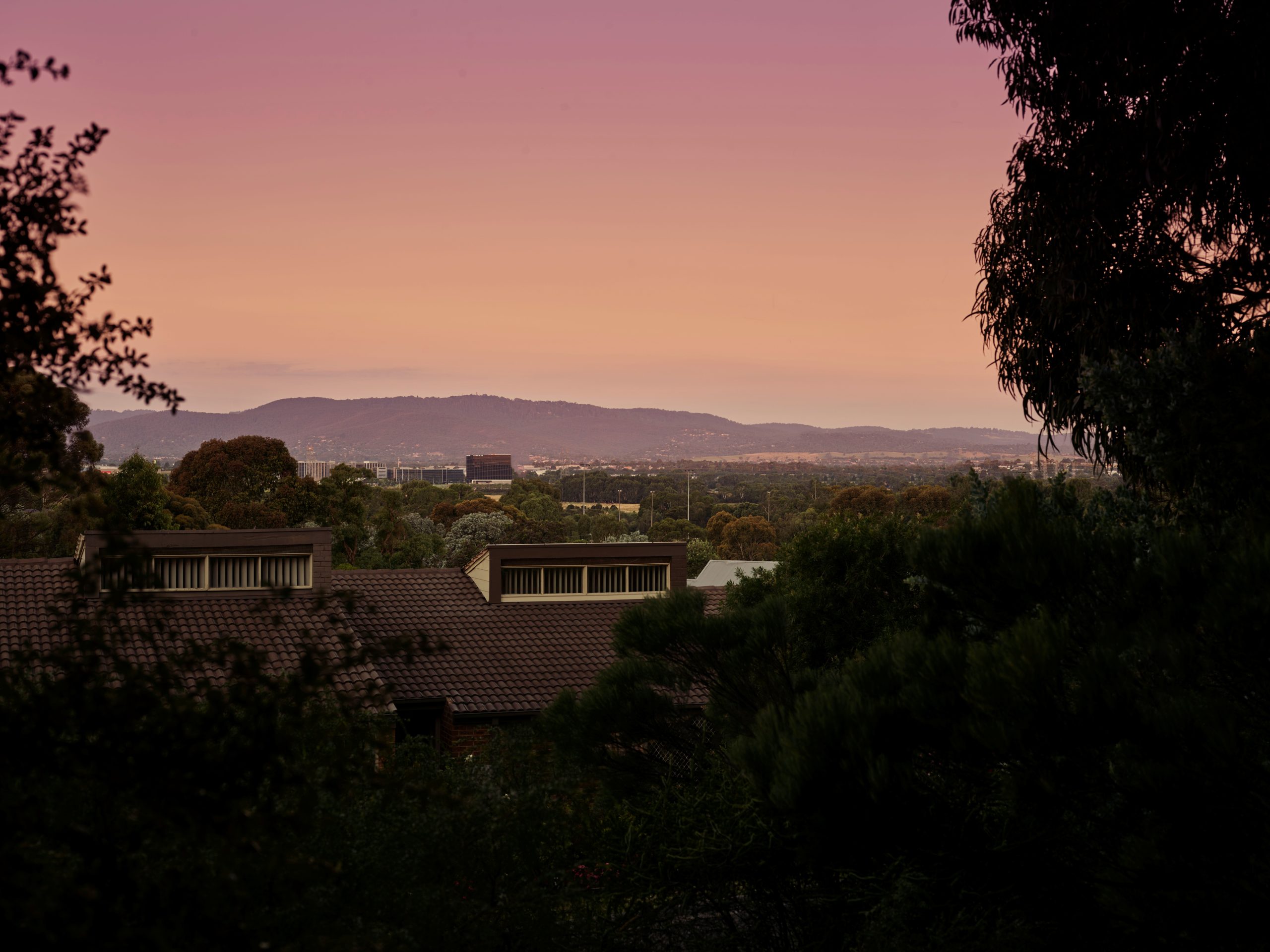 Sunrise over Melbourne's south-east suburbs with retirement village community in foreground, serving Wheelers Hill and Glen Waverley residents